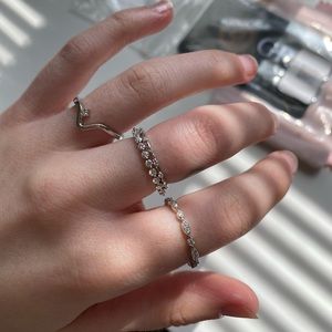 Lot of 4 sterling silver moissanite rings